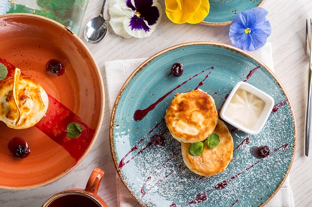 table with two dishes with food in it