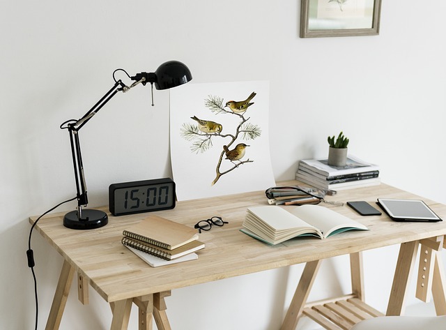 a table with books and lamp