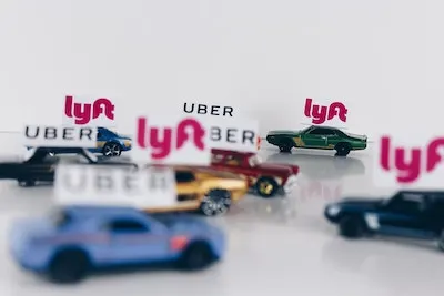 multiple lyft cars on a platform