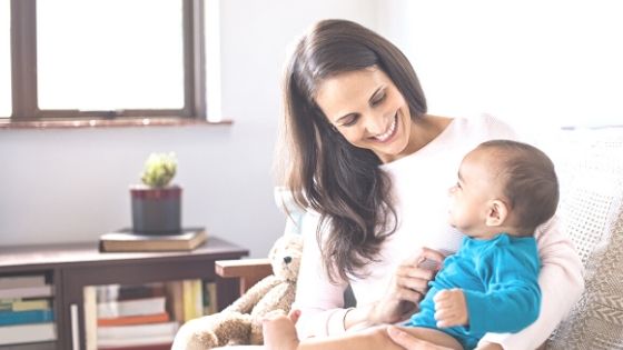 a mom with a baby in her lap for a blog post onbabysitting jobs near me (2)