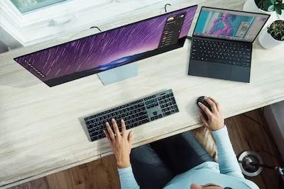 computer and a womans hand
