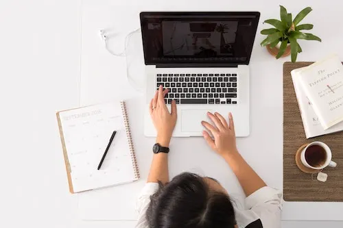 women on a laptop - blog graphic for a post on get paid to advertise