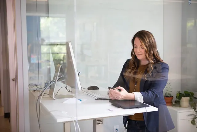 a single mom working at her desk on her side hustle 