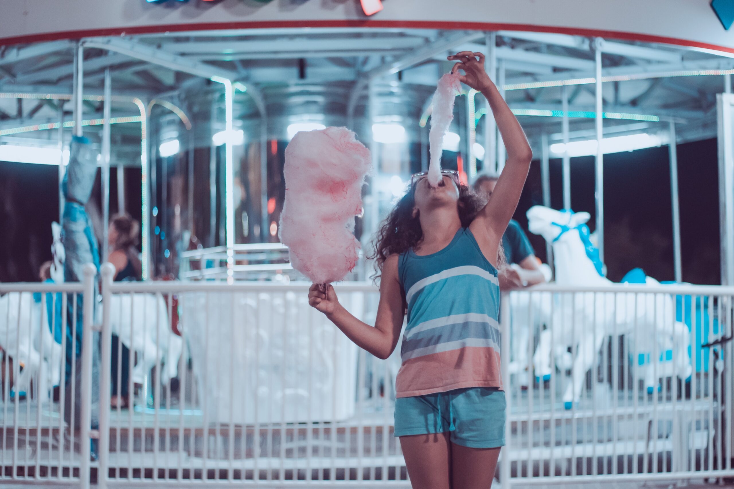 a kiddo eating cotton candy