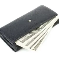 a wallet with money coming out of it