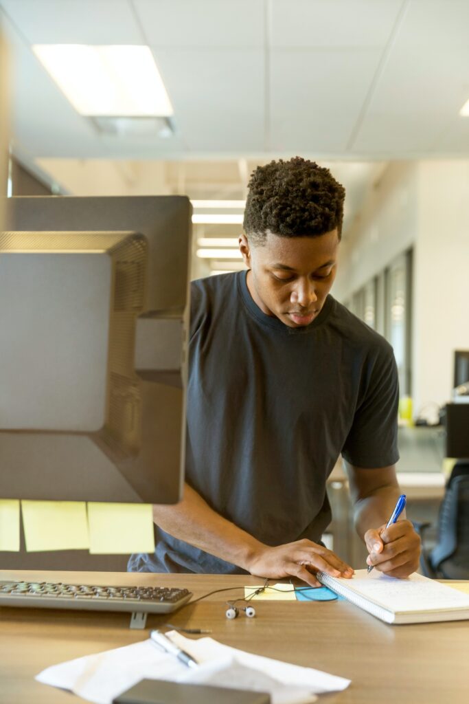 A teenager behind a counter working on something. graphic for a blog post on How to make money as a teenager without a job