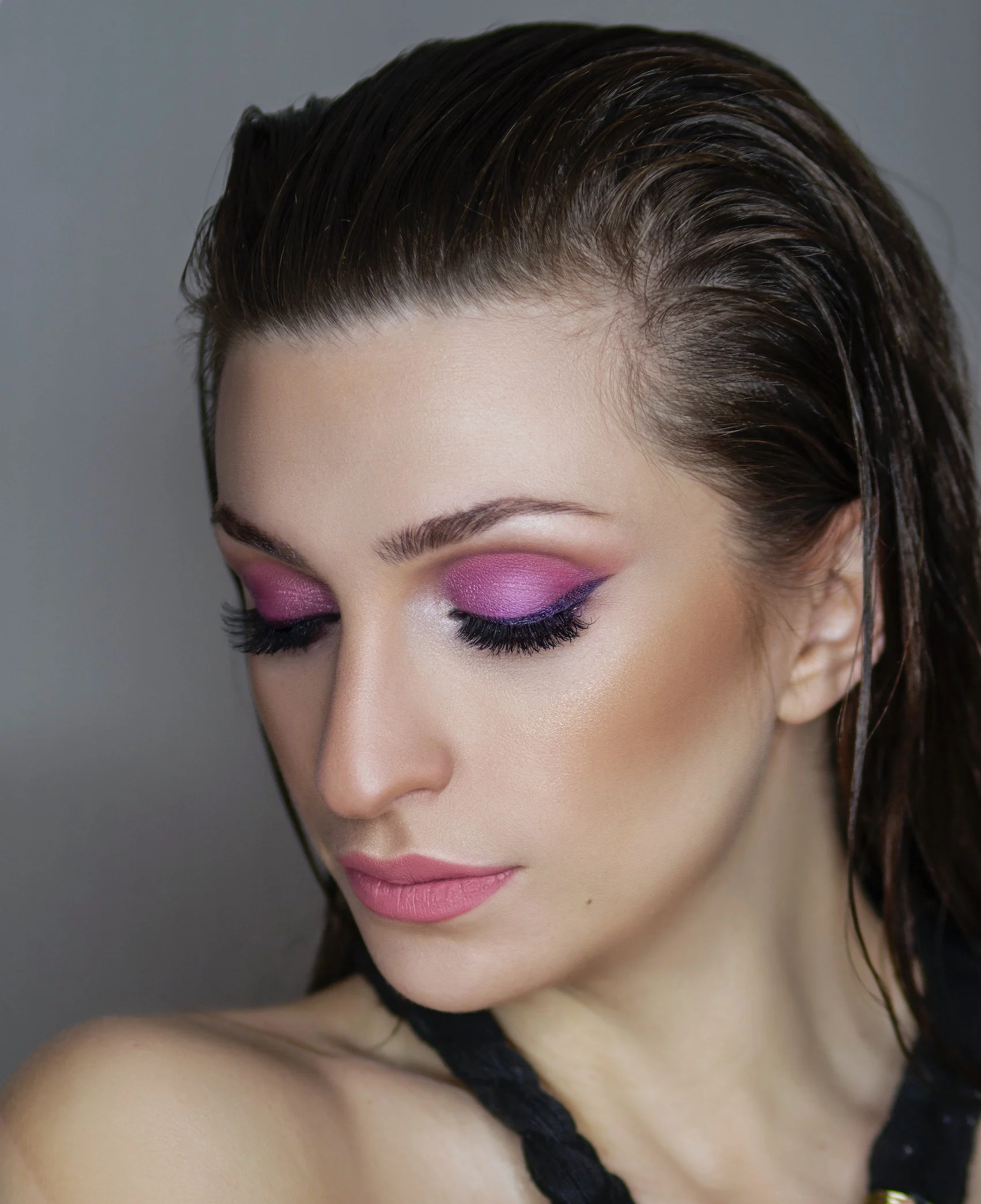 a girl with great eyelashes and pink eye shadow