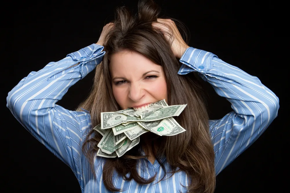 Frustrated money woman pulling hair