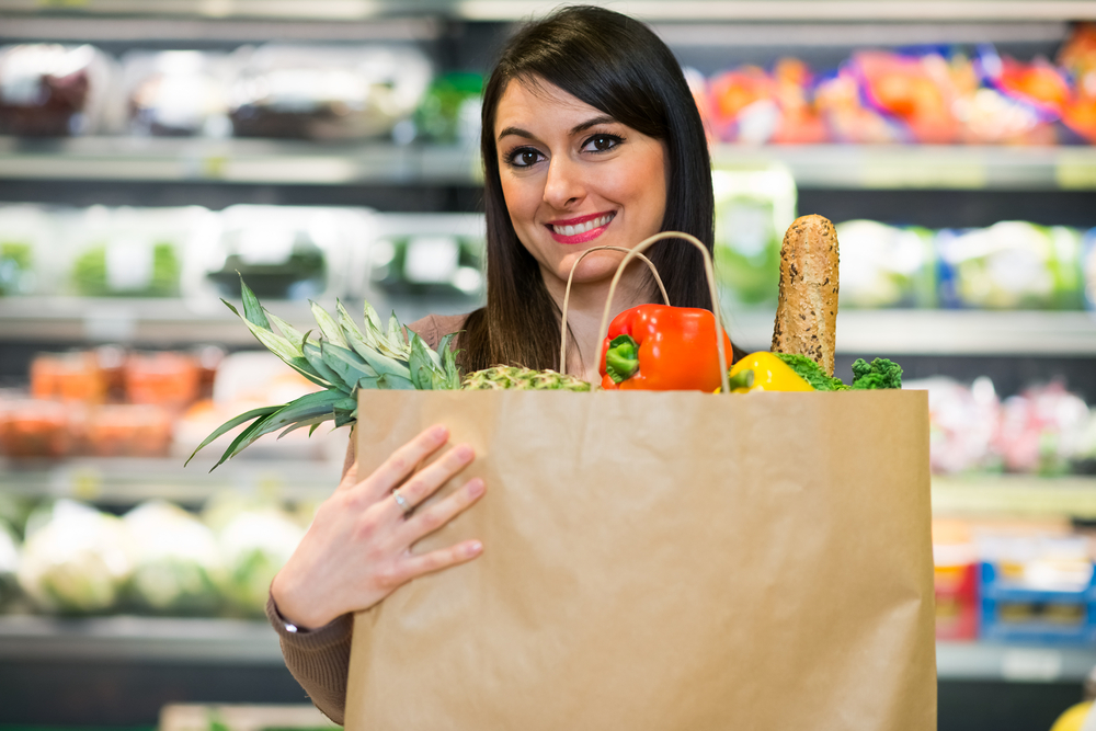 Woman holding food bag