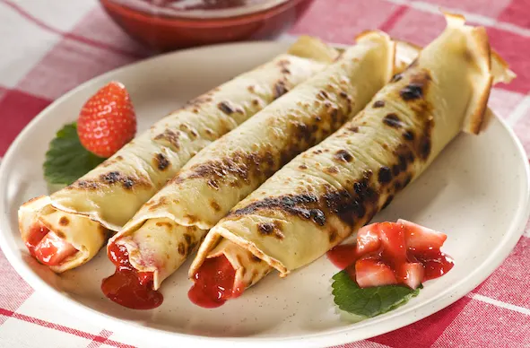 Pancakes with strawberry jam close up shoot