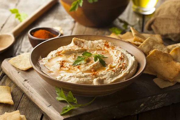Healthy Homemade Creamy Hummus with Olive Oil and Pita Chips