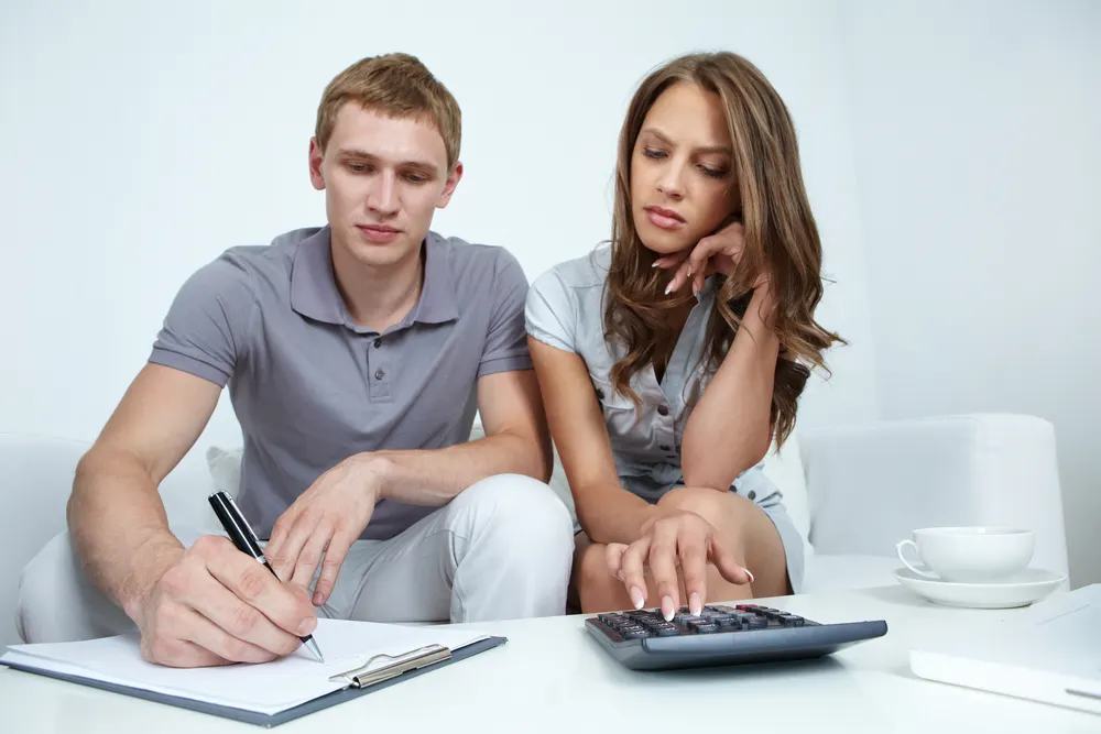 Young couple planning their budget