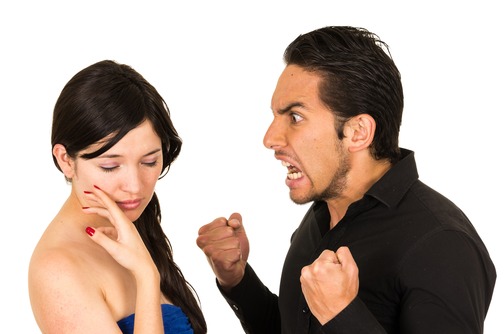 young unhappy angry man screaming at girlfriend wife isolated on white