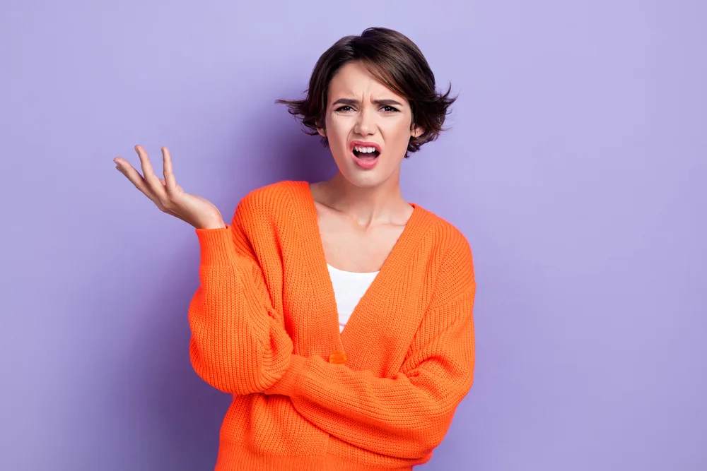 Photo of unsatisfied angry lady wear bright clothes disappointed bad behavior results isolated on purple color background.