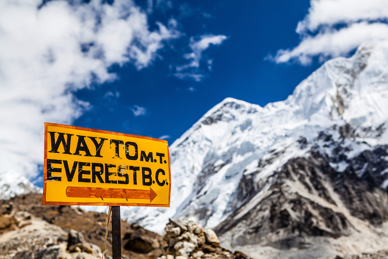 Mountains landscape and sign Way to Mt. Everest Base Camp signpost in Himalayas, Nepal