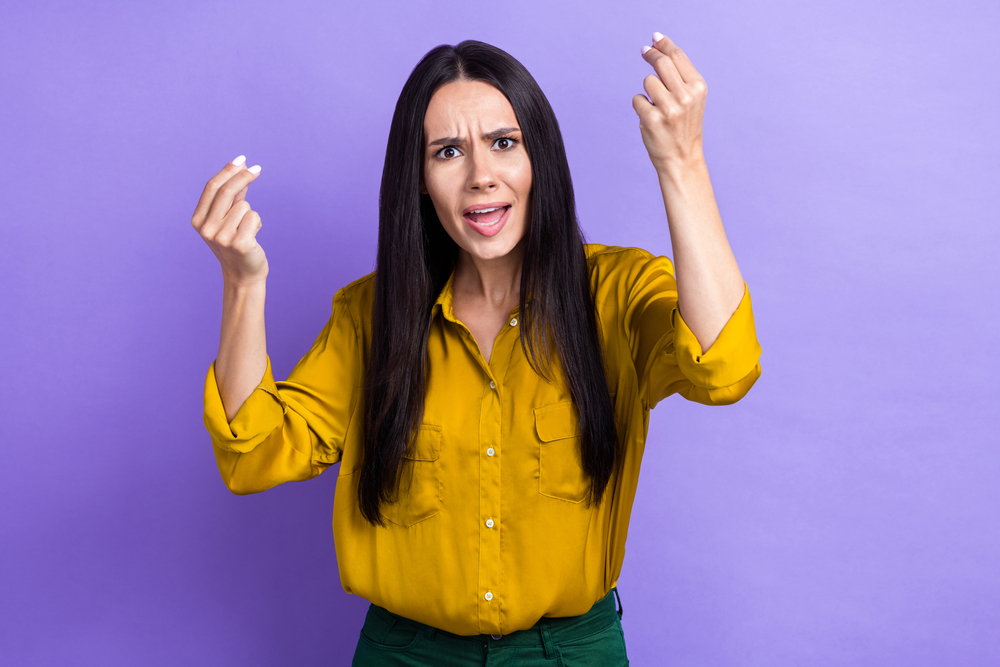 Photo of angry aggressive lady dressed stylish clothes showing arms pretense divorce quarrel isolated on purple color background.