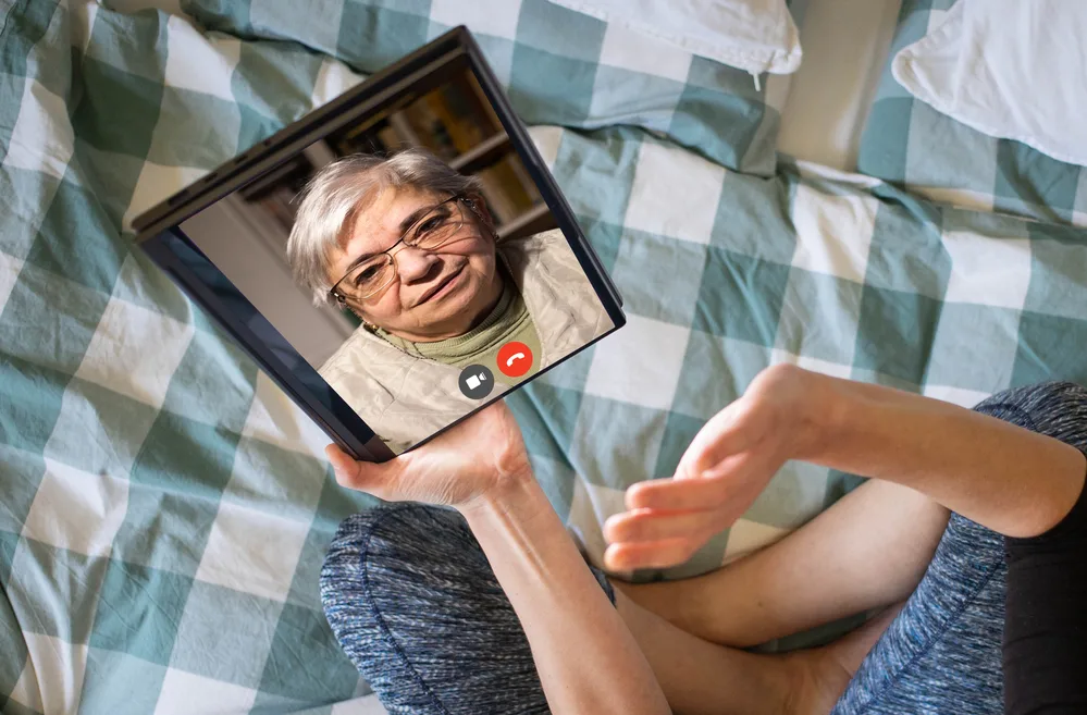 online communication social media elderly woman in an online call.