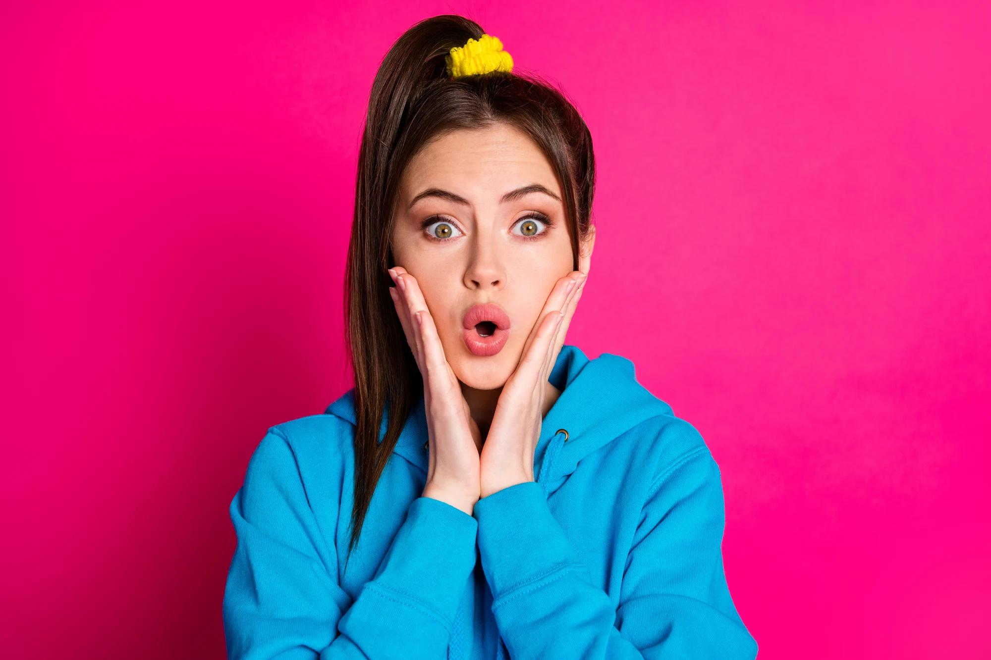 Photo of shocked young person hands on cheeks open mouth cant believe isolated on pink color background.