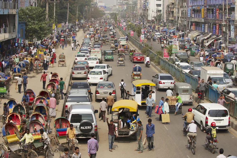 DHAKA, BANGLADESH - FEBRUARY 22, 2014: Busy traffic at the central part of the city on February 22, 2014 in Dhaka, Bangladesh. Dhaka is one of the most overpopulated cities in the world.