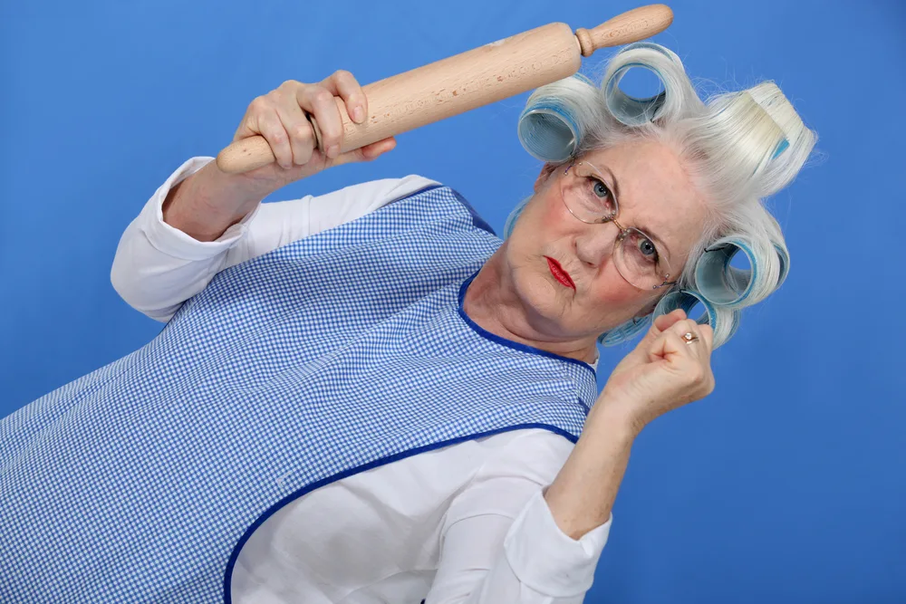 Angry old lady with rolling pin