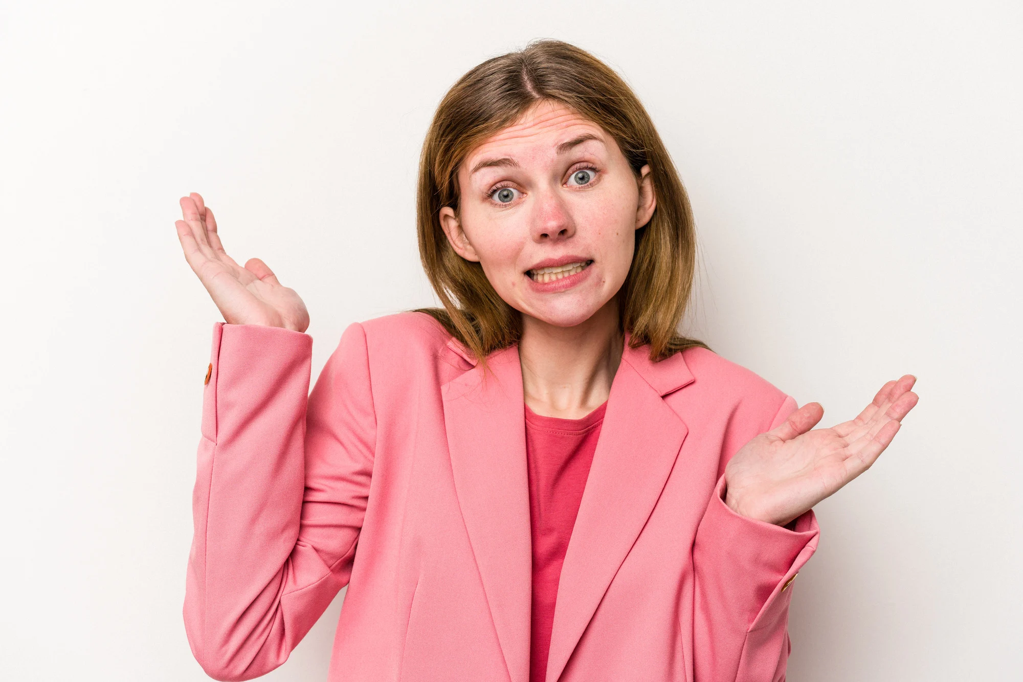 Young russian woman isolated on white background confused and doubtful shrugging shoulders to hold a copy space.