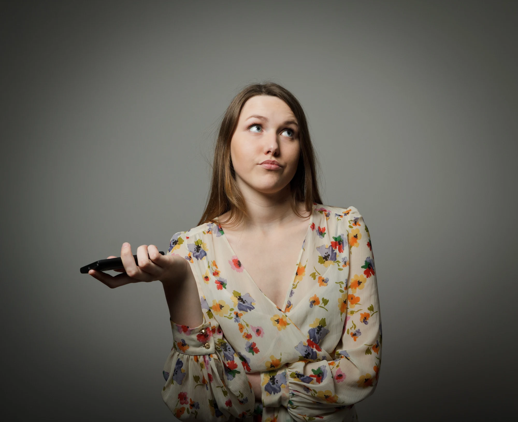 An annoyed and frustrated woman on the phone