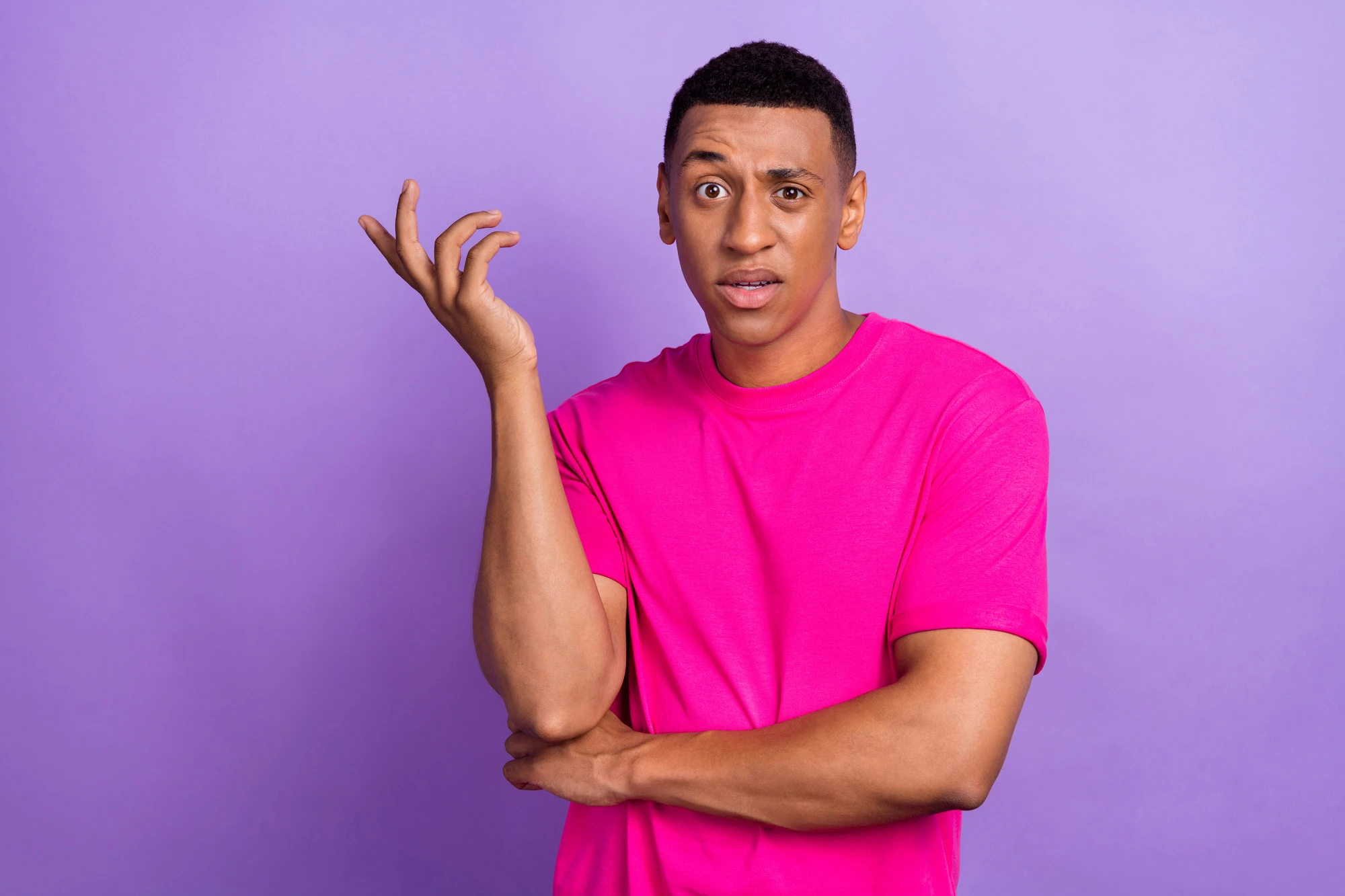 Closeup portrait photo of young boss student wear bright neon t-shirt eyebrow up misunderstanding hand up irritated isolated on purple color background.