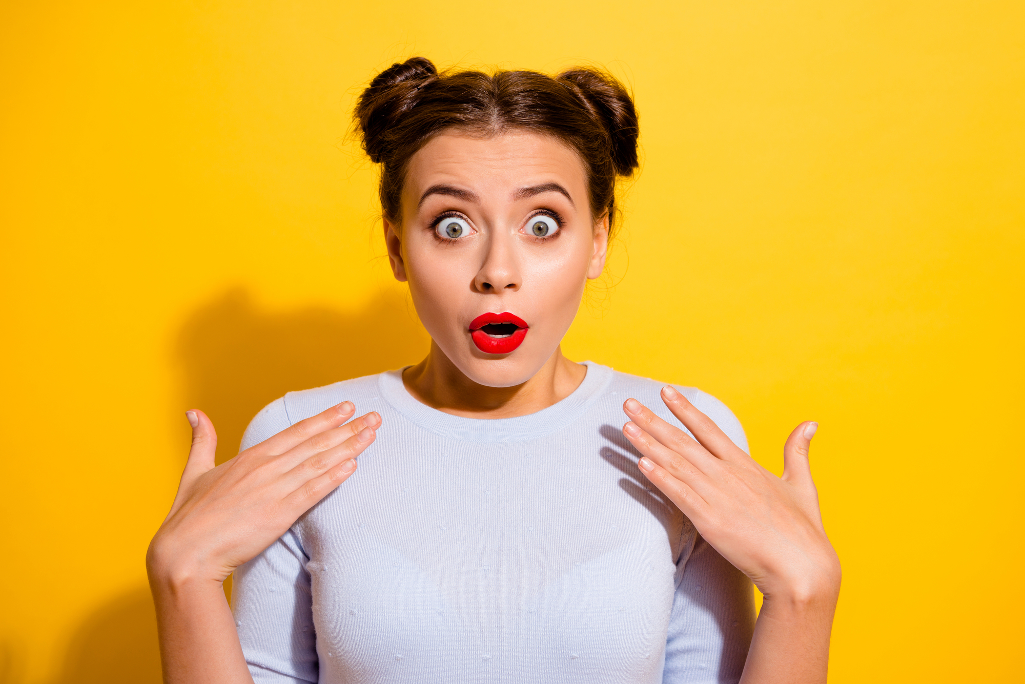Photo of shocked crazy girl can't believe her eyes and ears hear bad words about herself isolated on yellow color background.
