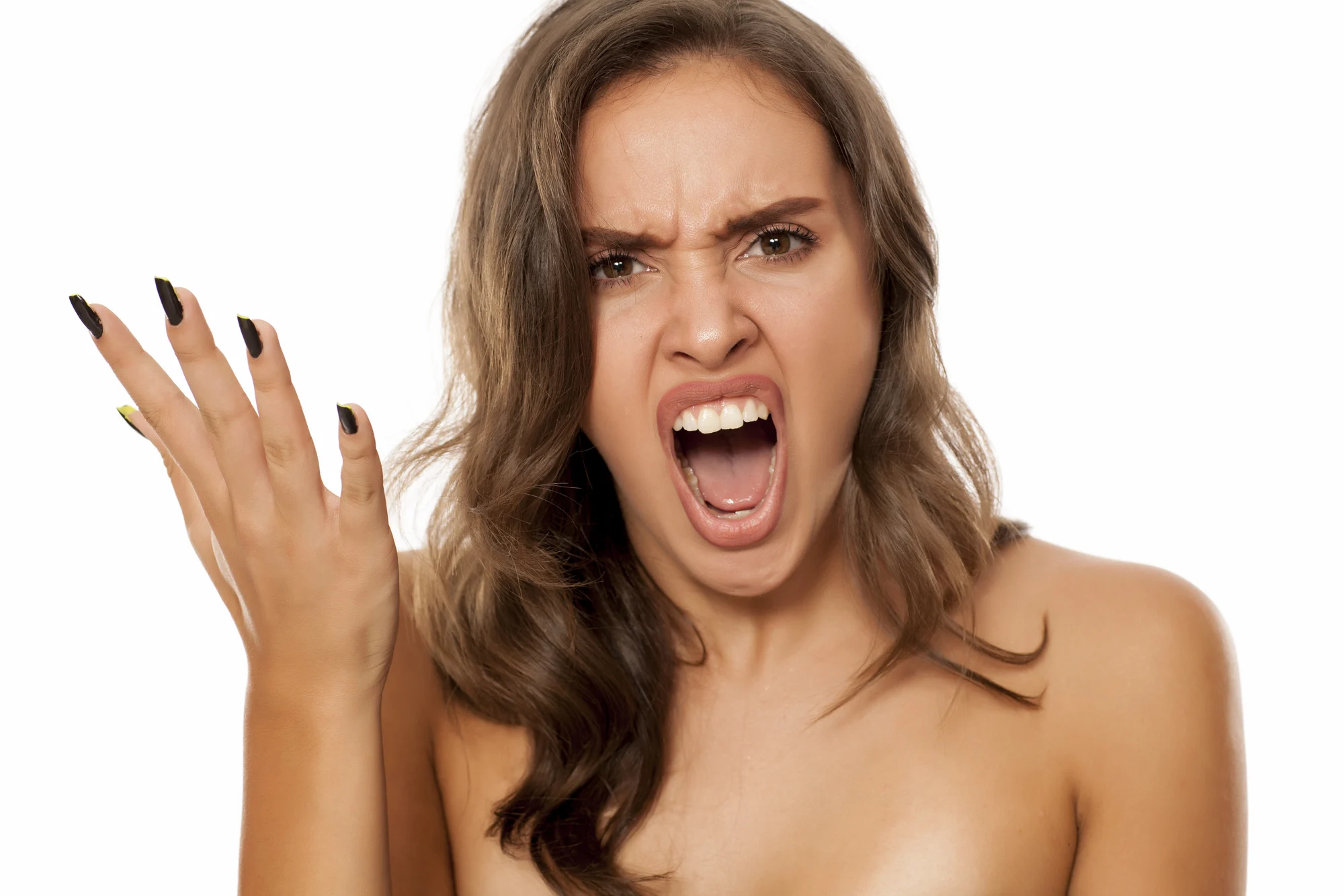 Portrait of beautiful young angry woman on white background