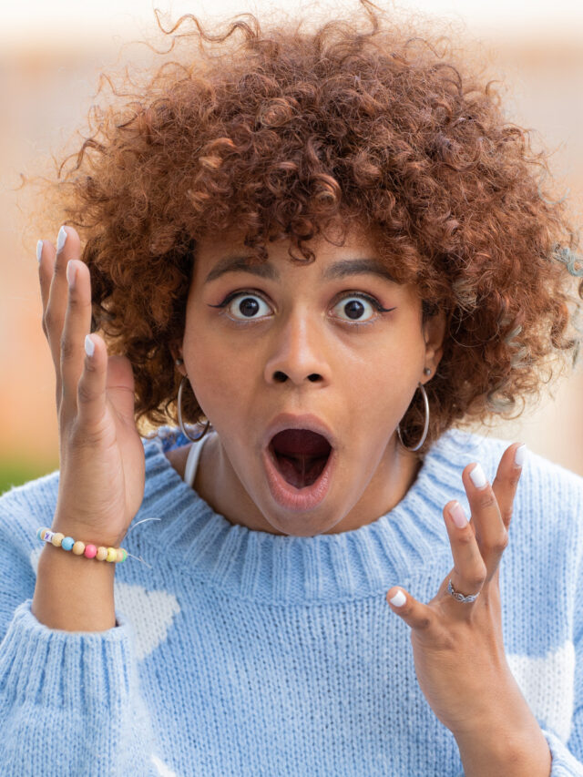 african american girl in the street with surprised expression