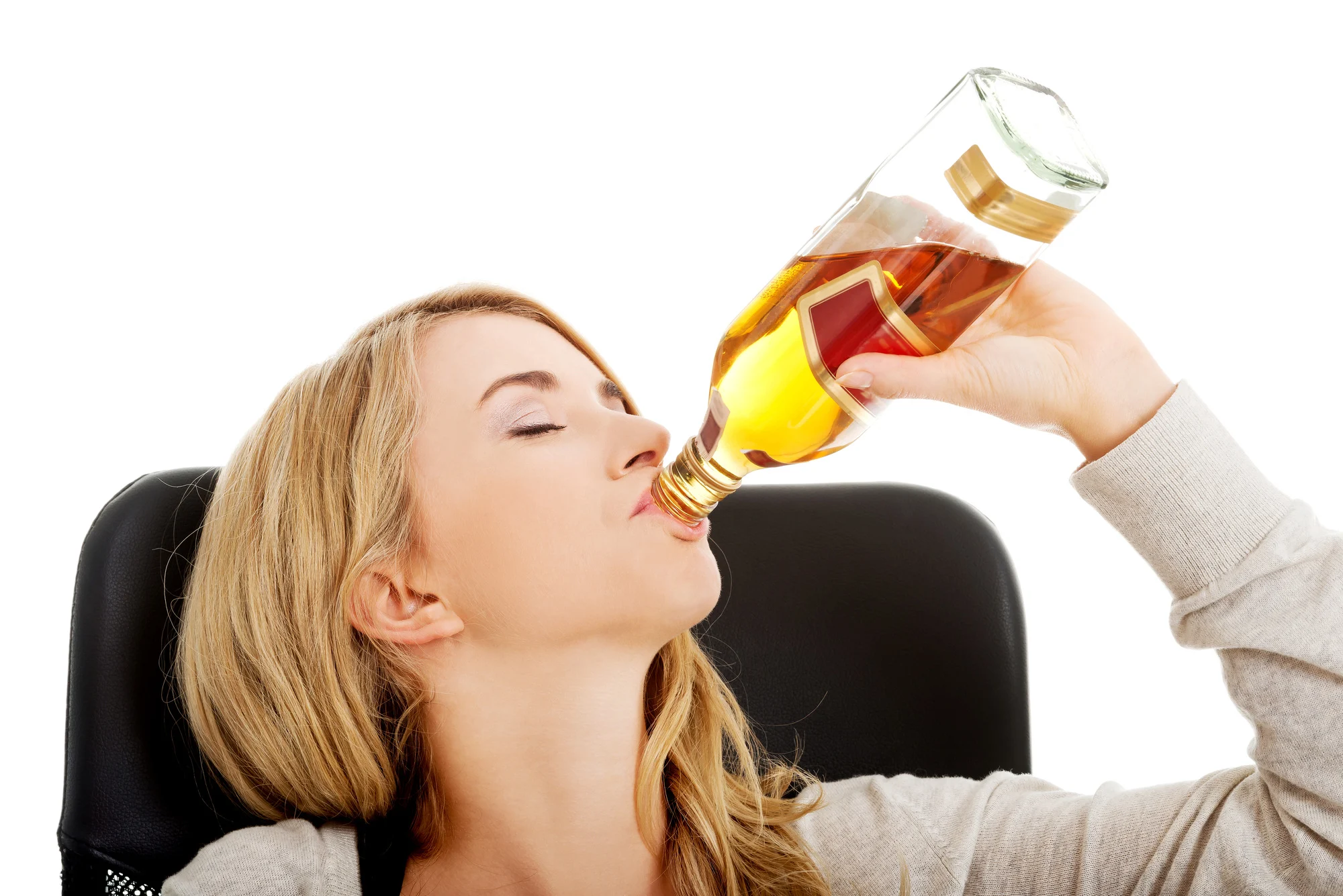 Yound beautiful woman in depression, drinking alcohol
