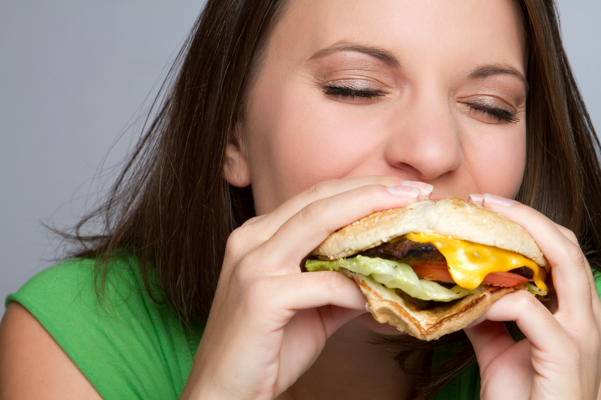 Beautiful girl eating hamburger food