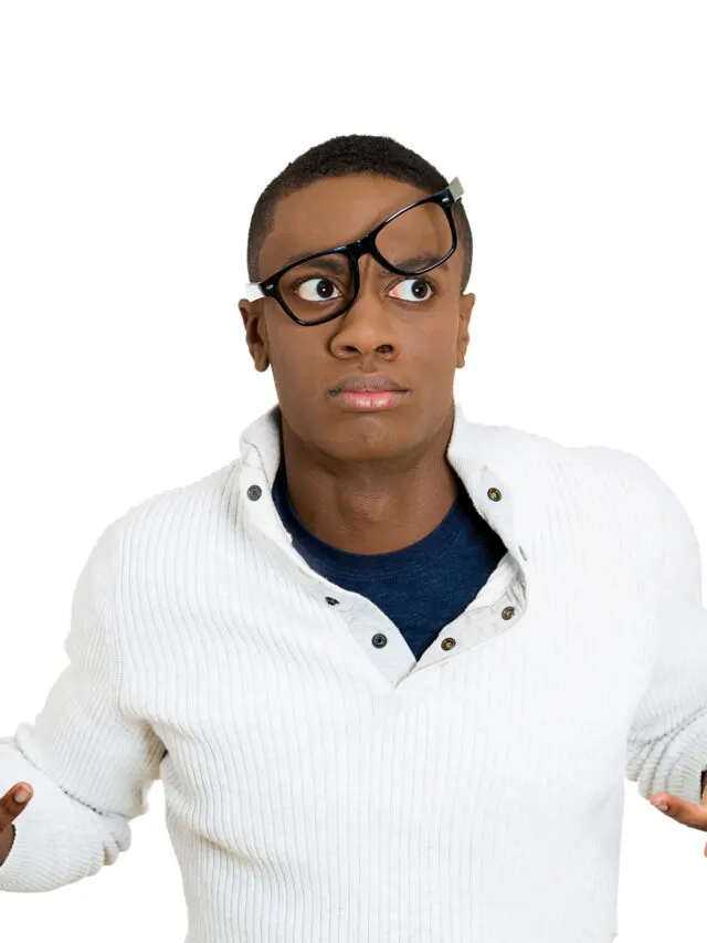 Closeup portrait, dazed, nerd young man with big glasses messed on face, open mouth, embarrassed, failed excuse me isolated white background. Negative human emotion face expression feeling