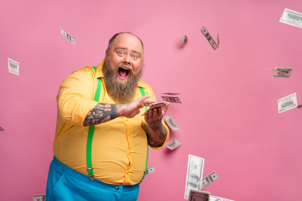 Portrait of his he nice cheerful cheery glad excited bearded guy throwing, investment winning cashback having fun us dollars flying isolated over pink pastel color background