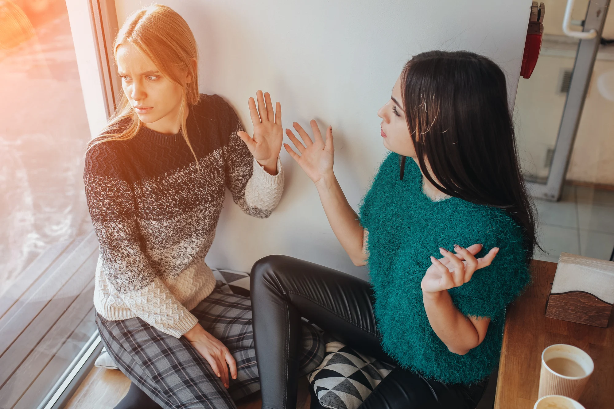 quarrel two friends. Two women screaming at each other.