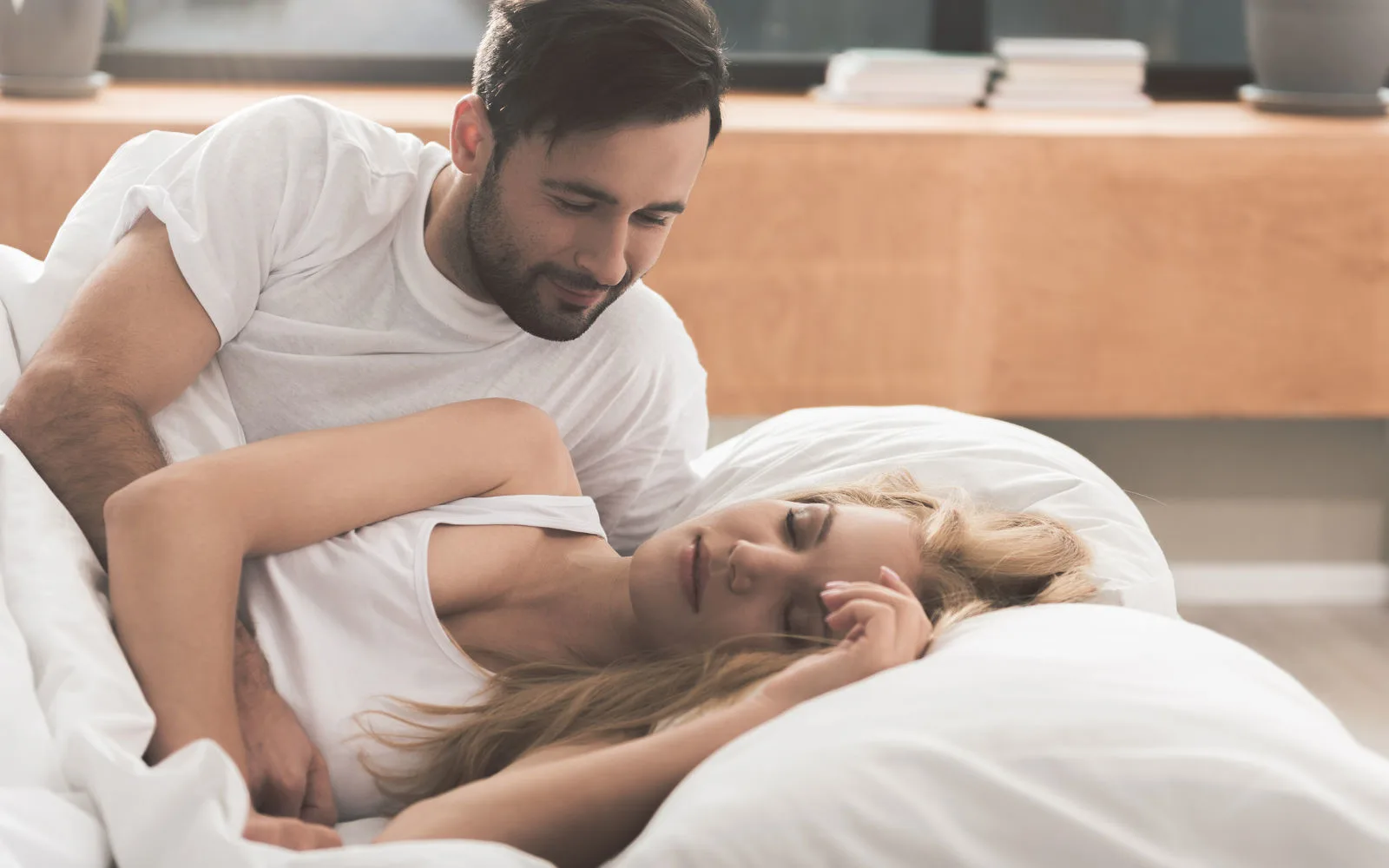 man admiring woman in her sleep