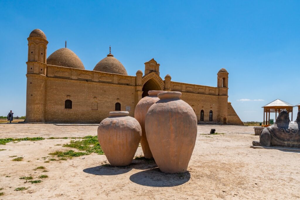 Turkestan Arystan Bab Mausoleum Breathtaking Picturesque View with Clay Pots on a Sunny Blue Sky Day