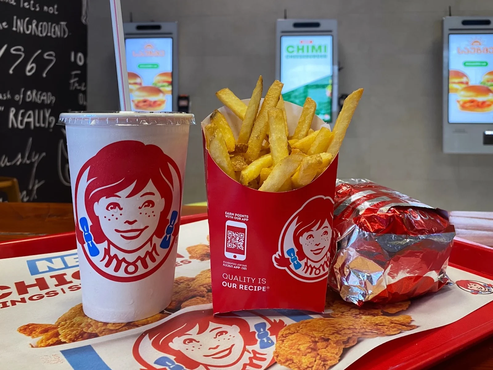Close-up of french fries, drink and Burger on a tray at Wendys fast food restaurant: Batumi, Georgia, July 14, 2023.