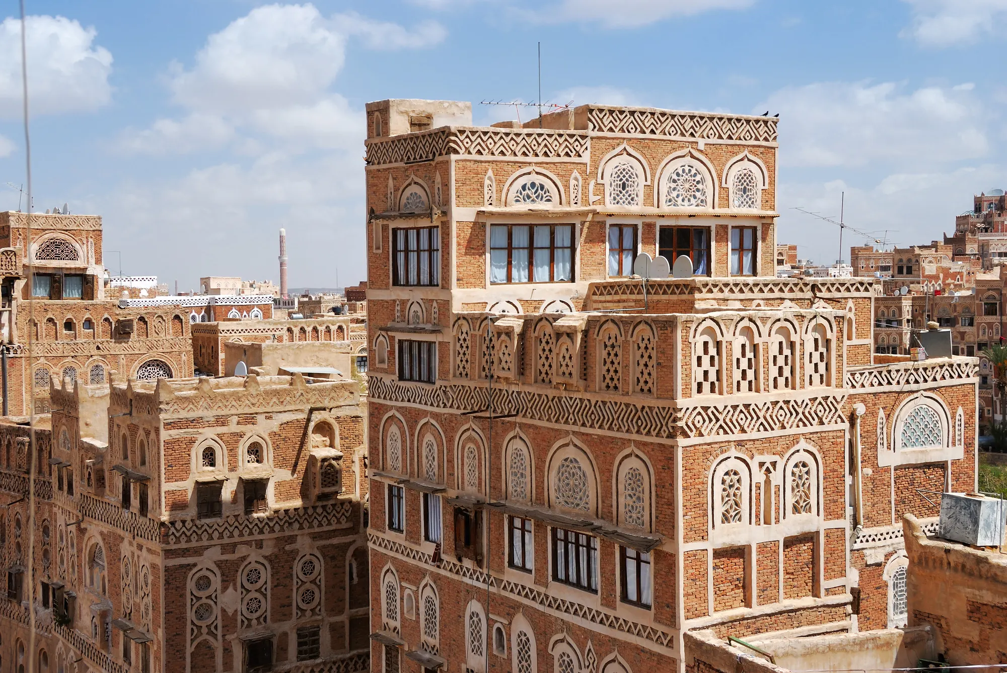 Traditional architecture in Sanaa at sunrise, Yemen. Inhabited for more than 2.500 years at an altitude of 2.200 m, the Old City of Sanaa is a UNESCO World Heritage City